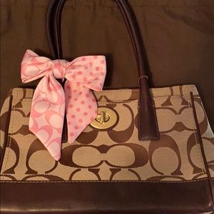 Coach signature w/ pink bow.